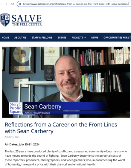 Screen capture from announcement of radio interview with Sean Carberry. "Reflections from a Career on the Frontlines with Sean Carberry." There is a photo of Sean in a navy blue sweater over a white buton-up shirt. He in in front of a bookcase. You can just make out some sort of recording award in the background. He's smiling.